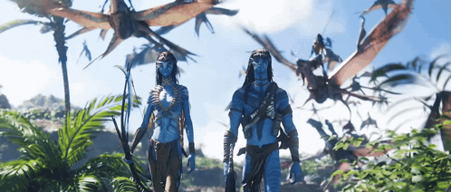 Man And Woman In Jungle With Flying Animals GIF