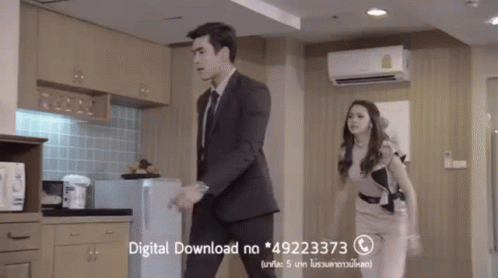 Man And Woman In Kitchen With Download Ad GIF