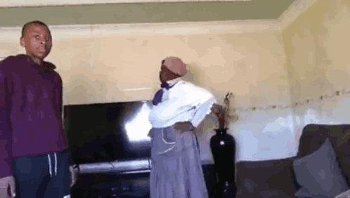Man and Woman in Living Room with Flat Screen TV