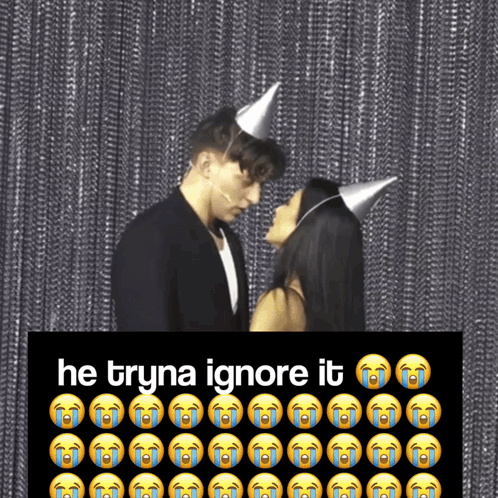 Man and Woman in Party Hats Kissing He Tryna Ignore It