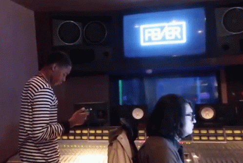 Man and Woman in Recording Studio With Fbbr Screen