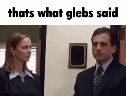 Man and Woman in Suits Standing