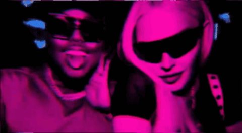 Man and Woman in Sunglasses in Pink Light