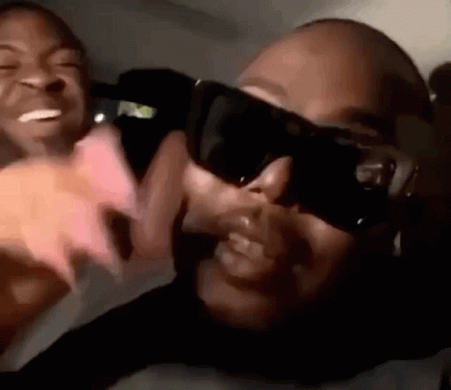 Man And Woman In Sunglasses Sitting Together GIF