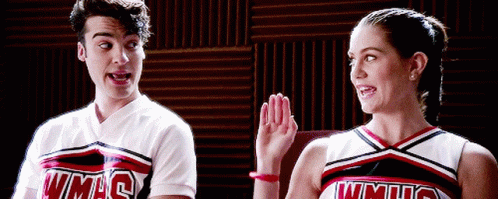 Man And Woman In WMHS Cheerleading Uniforms GIF