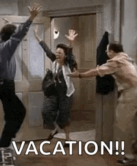Man and Woman Jumping in Doorway with Hands Up
