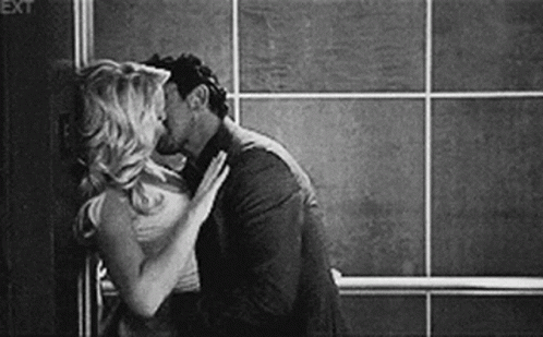 Man And Woman Kissing GIF