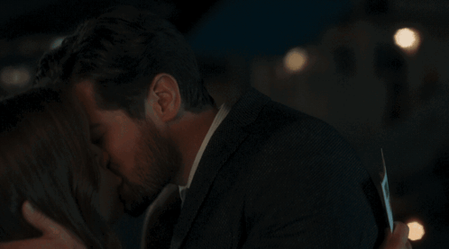 Man And Woman Kissing GIF