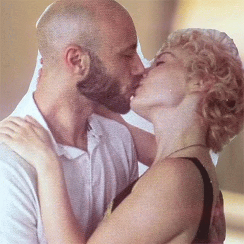 Man and Woman Kissing Blonde Hair