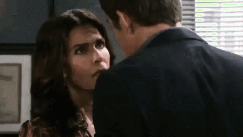 Man And Woman Kissing By Window GIF