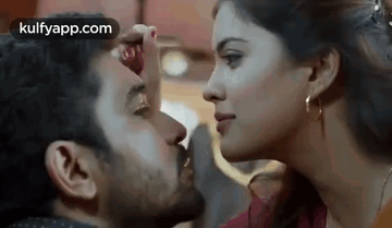 Man and Woman Kissing Cheek
