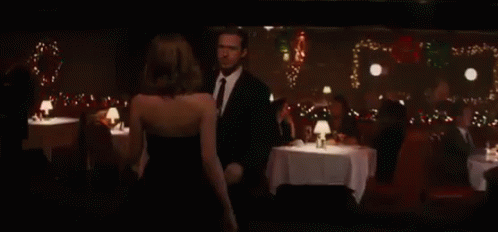 Man And Woman Kissing In Bar GIF
