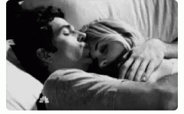 Man And Woman Kissing In Bed Black And White GIF