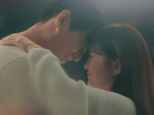 Man and Woman Kissing in Blurry Photo