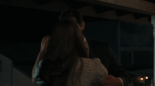 Man and Woman Kissing in Dark