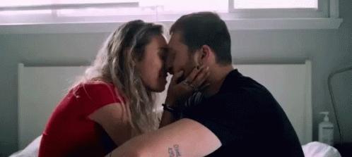 Man And Woman Kissing In Dark Room GIF