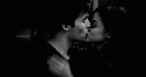 Man And Woman Kissing In Dark Room GIF