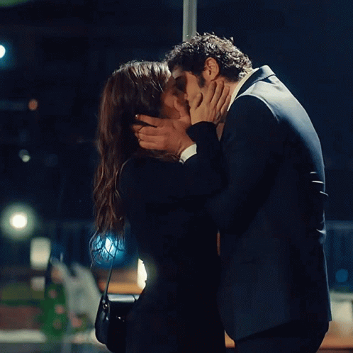 Man And Woman Kissing In Dark Room GIF