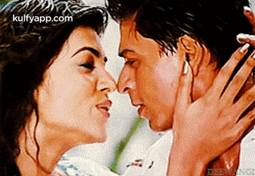 Man And Woman Kissing In Front Of Kulfyapp.com GIF