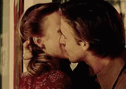 Man And Woman Kissing In Front Of Mirror GIF