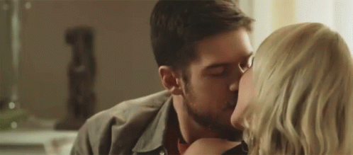 Man And Woman Kissing In Front Of Mirror GIF