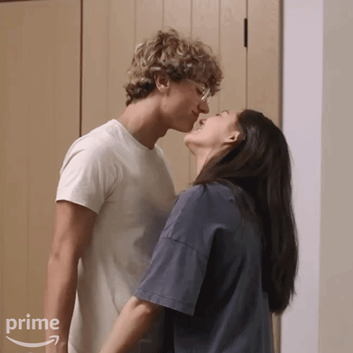 Man And Woman Kissing In Front Of Prime Logo GIF