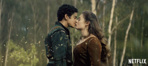 Man and Woman Kissing in Front of Trees with Netflix