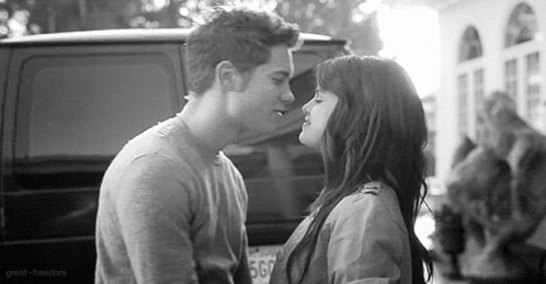 Man And Woman Kissing In Front Of Van GIF