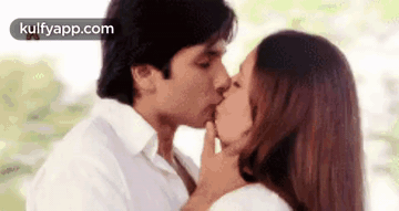 Man And Woman Kissing In Front Of Window GIF