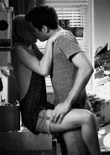 Man And Woman Kissing In Kitchen GIF