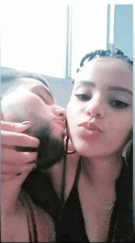 Man and Woman Kissing in Mirror