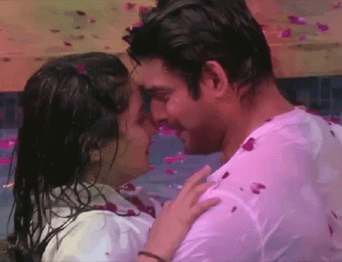 Man and Woman Kissing in Petal Pool