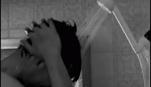 Man And Woman Kissing In Rain GIF
