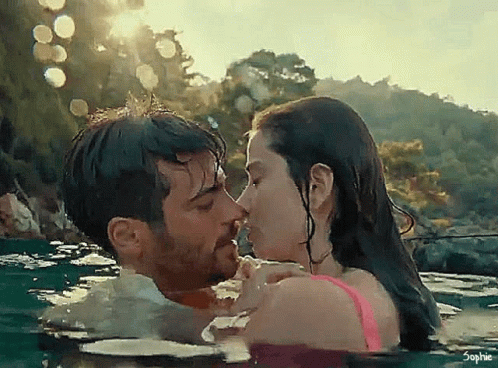 Man And Woman Kissing In Water GIF