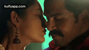 Man And Woman Kissing GIF