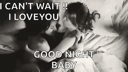 Man and Woman Kissing on a Bed