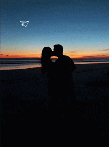 Man and Woman Kissing on Beach 26.03