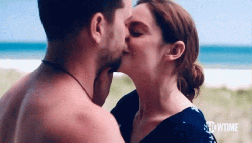 Man And Woman Kissing On Beach GIF