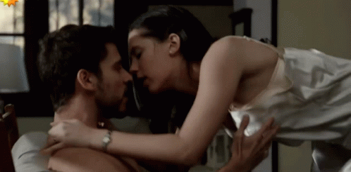 Man And Woman Kissing On Bed Woman Wearing Watch GIF