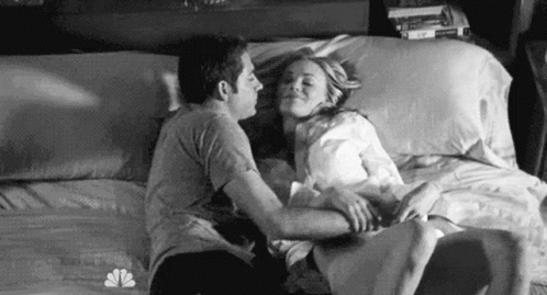 Man and Woman Kissing on Bed