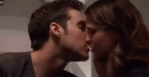 Man and Woman Kissing on Cheek
