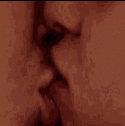 Man and Woman Kissing Open Mouths