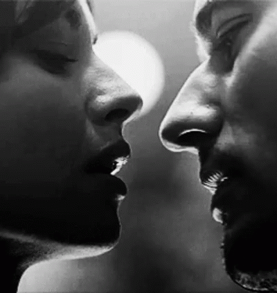 Man And Woman Kissing GIF