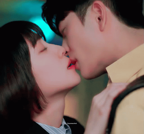 Man And Woman Kissing Supermarket GIF