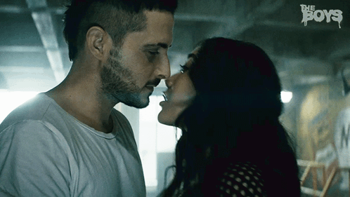 Man and Woman Kissing with Boys Text
