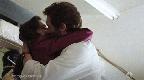 Man And Woman Kissing With Council Of Dads GIF