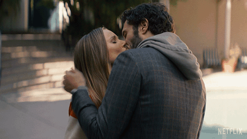 Man And Woman Kissing With Netflix Logo GIF