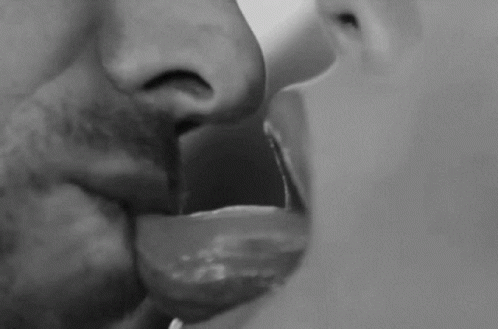 Man and Woman Kissing With Tongues Out