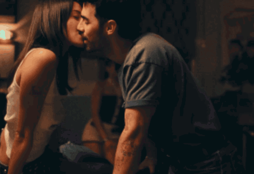 Man And Woman Kissing Woman In White Tank Top GIF