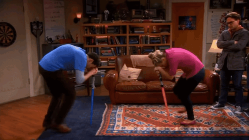 Man and Woman Kneeling in Front of Couch